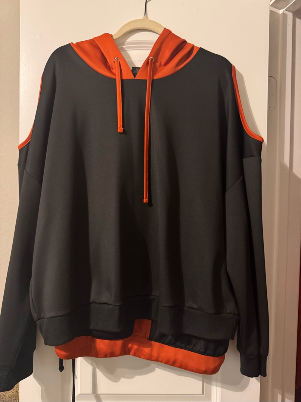 Cold-Shoulder Hoodie Sweater in Black and Burnt Orange